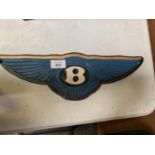 A BENTLEY CAST IRON SIGN