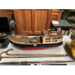 A HAND MADE MODEL OF A SAILING BOAT WITH VINTAGE DIE CAST CARGO MODELS