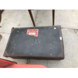 A VINTAGE LEATHER SUITCASE