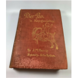A 1910 PETER PAN IN KENSINGTON GARDENS BOOK IN ORIGINAL RUSTIC RED CLOTH BINDING BY J.M. BARRIE WITH