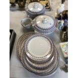 AN EDWARDIAN CERAMIC PURPLE AND WHITE PATTERN PART DINNER SERVICE