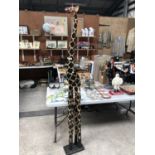 A LARGE WOODEN MODEL OF A GIRAFFE