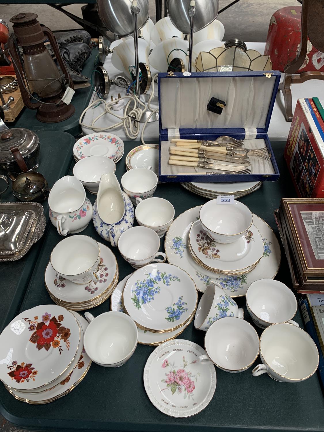 A BOXED CUTLERY SET AND TEA CUPS AND SAUCERS ETC