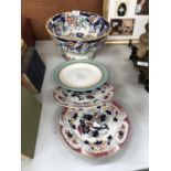 A LARGE CERAMIC IRONSTONE BOWL AND THREE FURTHER PLATES