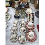 A MIXED GROUP OF CERAMIC ITEMS TO INCLUDE CUPS AND SAUCERS , JUGS ETC