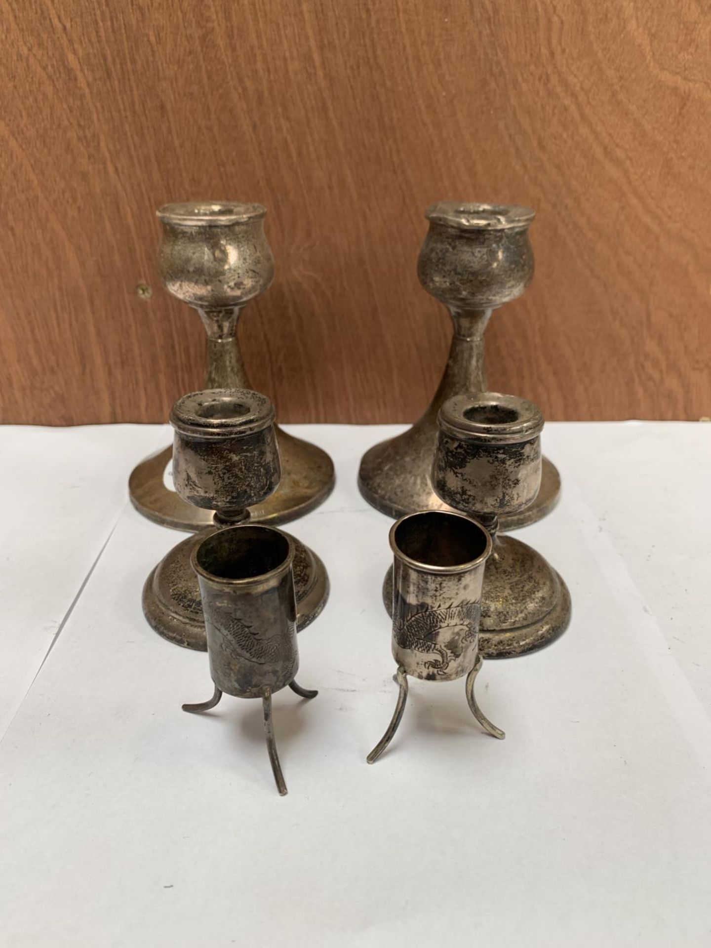 TWO PAIRS OF HALLMARKED SILVER CANDLE STICKS AND TWO CHINESE WHITE METAL MINIATURE POTS (6)