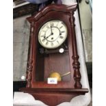 A 'H.SAMUEL' WOODEN CASED CHIMING CLOCK