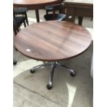 A RETRO CIRCULAR TOPPPED TABLE WITH CHROME BASE