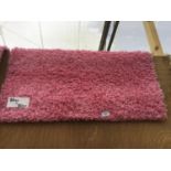 AN AS NEW 80CM X 80CM PINK PILE RUG