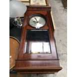 A VINTAGE WOODEN CHIMING WALL CLOCK WITH GLASS WINDOW