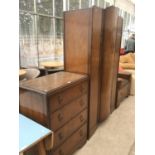 AN OAK THREE PIECE BEDROOM SUITE - A DRESSING TABLE, WARDROBE AND CHEST OF FOUR DRAWERS