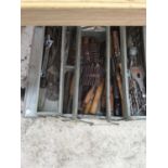 A METAL FOLD OUT TOOL BOX WITH CONTENTS TO INCLUDE CHISELS, DRILL BITS ETC