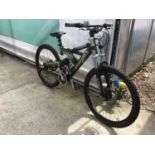 A SILVER FOX BIG FOOT MOUNTAIN BIKE WITH AN 18 SPEED SHIMANO TOURNEY GEAR SYSTEM