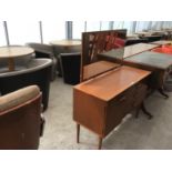 A RETRO TEAK DRESSING TABLE WITH ONE DOOR, THREE DRAWERS AND UPPER MIRROR