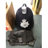 A VINTAGE POLICEMAN'S HELMET AND GLOVES