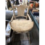 A VINTAGE WOODEN HIGH CHAIR