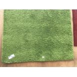 AN AS NEW 220CM X 140CM GREEN RUG