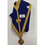 A BLUE AND GOLD MASONIC SASH WITH MEDAL
