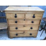 A PINE CHEST OF TWO SHORT OVER THREE LONG DRAWERS