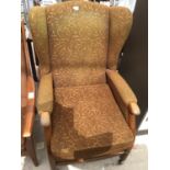 A RETRO WING BACK ARMCHAIR