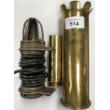 A GROUP OF THREE ITEMS - ARMOURED FIGHTING VEHICLE INSPECTION LAMP, TRENCH ART SHELLS