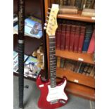 A RED ELECTRIC 'SQUIRE' GUITAR