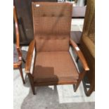 A RETRO MAHOGANY UPHOLSTERED ARMCHAIR