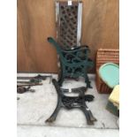 TWO PAIRS OF CAST IRON BENCH ENDS AND A BENCH BACK