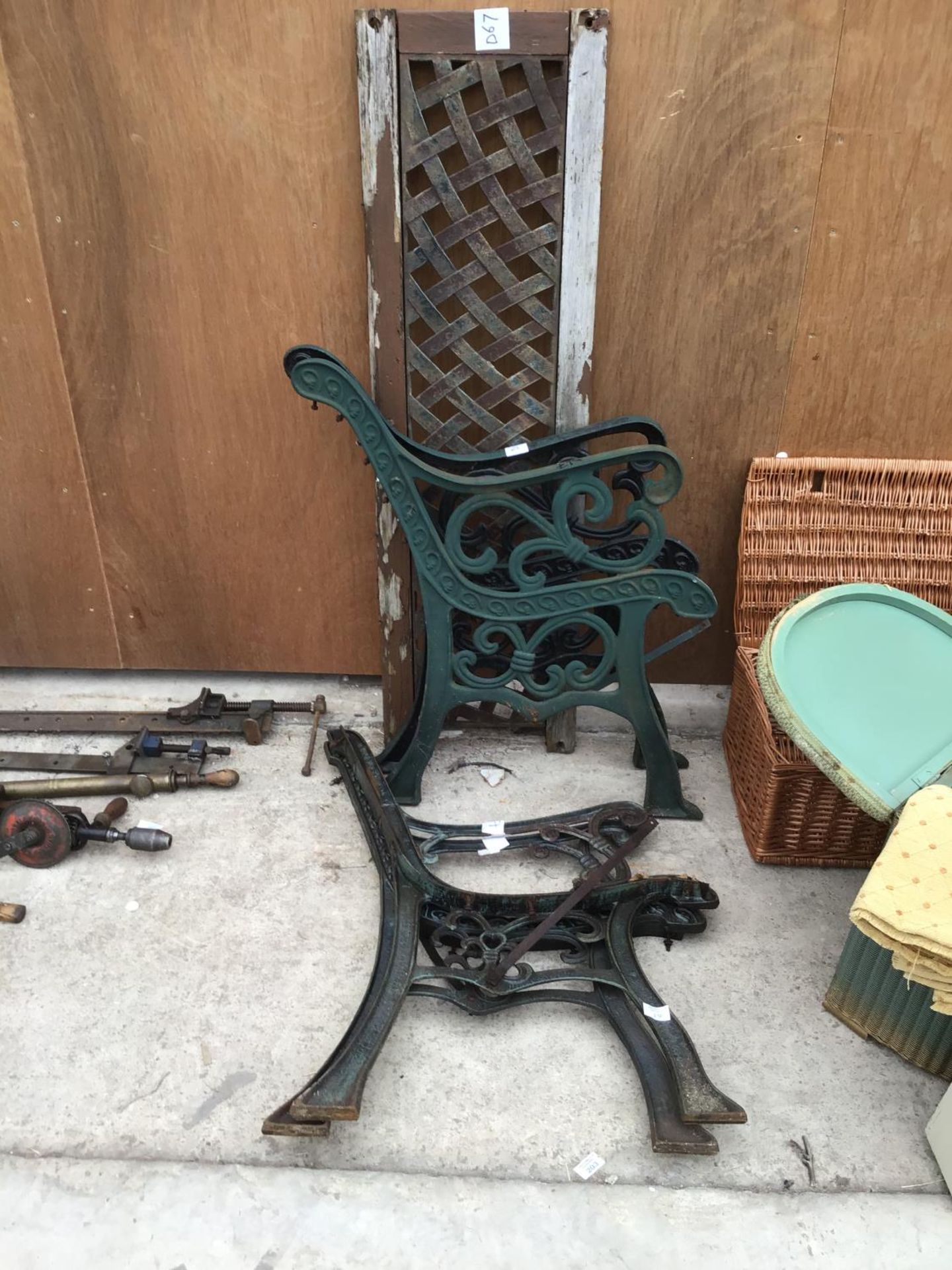 TWO PAIRS OF CAST IRON BENCH ENDS AND A BENCH BACK