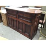 A MAHOGANY DOUBLE BAR WITH PANELLED DESIGN