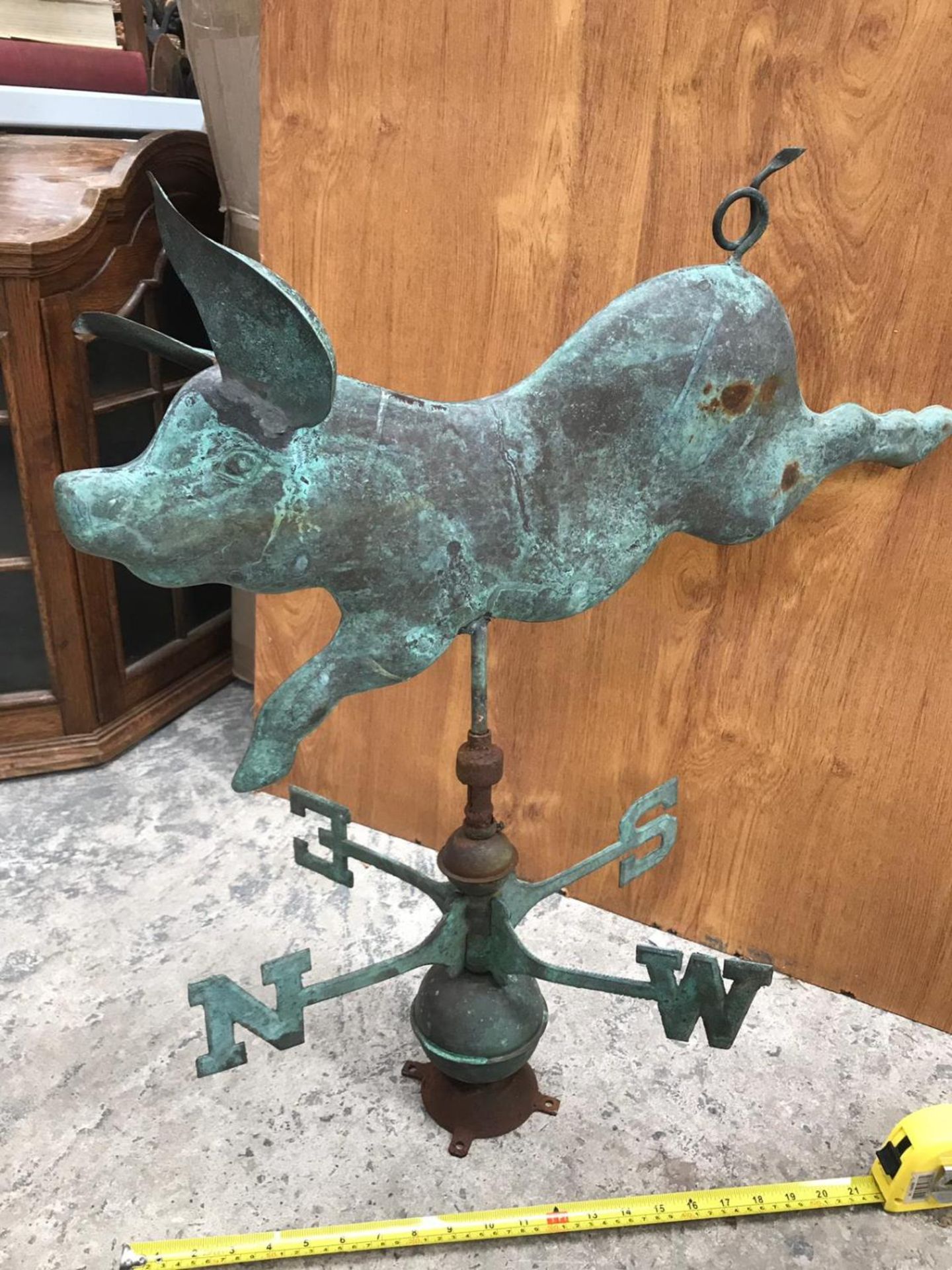 A VINTAGE COPPER WEATHER VANE OF A FLYING PIG