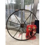 A LARGE METAL VINTAGE WHEEL