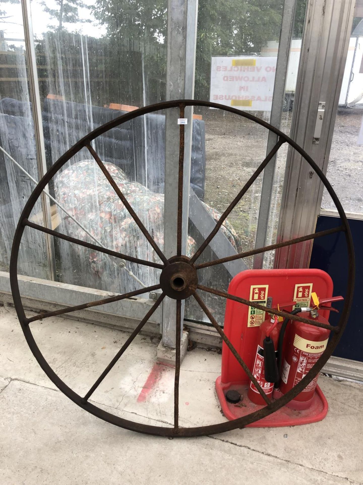 A LARGE METAL VINTAGE WHEEL