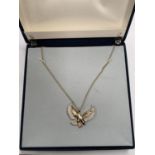 A BOXED 'OLIVER GUILT' EAGLE NECKLACE