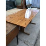 A MODERN PINE DINING TABLE