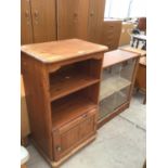 A PINE SINGLE DOOR CABINET AND TEAK BOOKCASE WITH SLIDING DOORS (2)