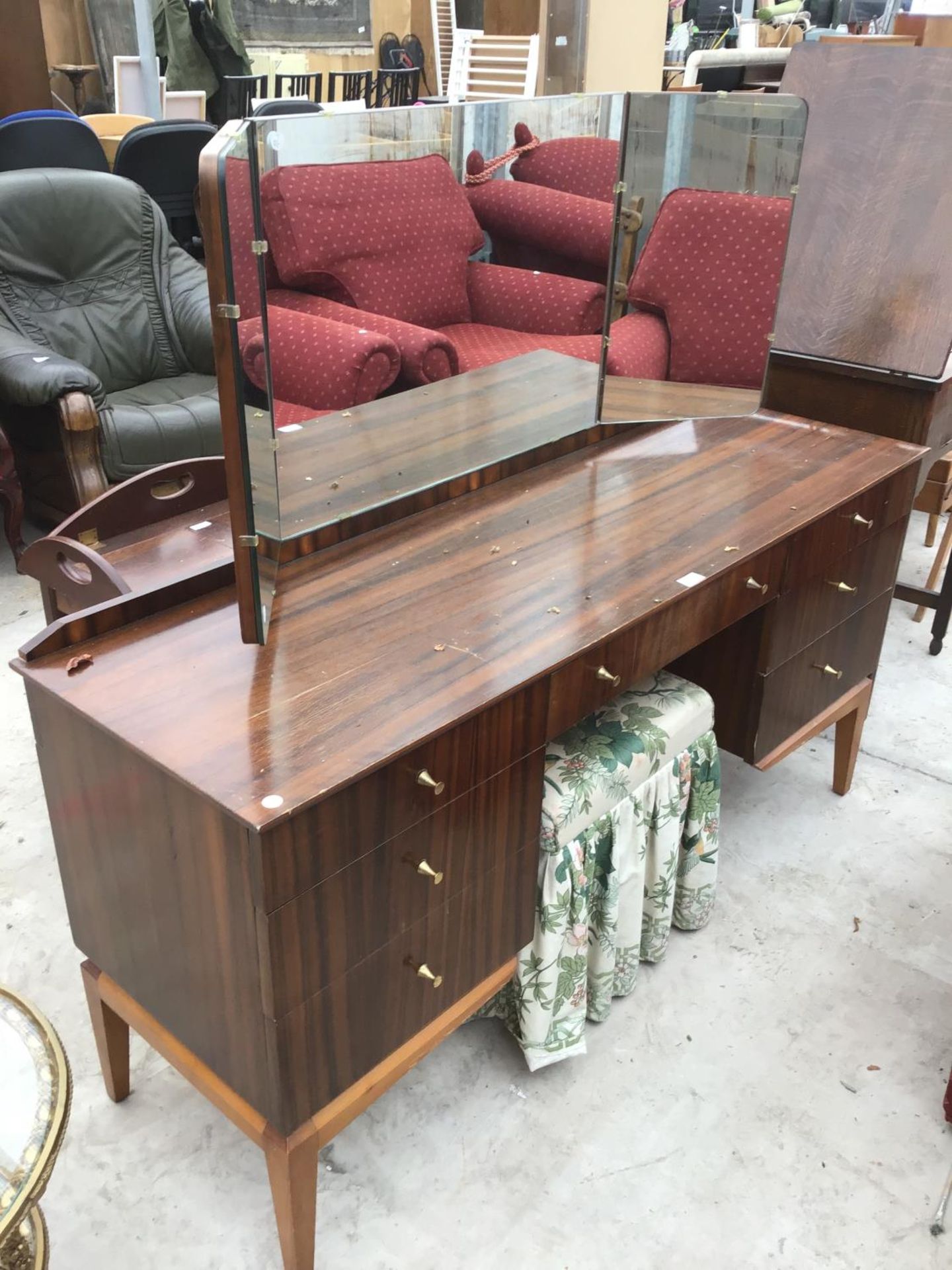 A ROSEWOOD EFFECT DRESSING TABLE WITH UPPER GLAZED MIRROR AND STOOL