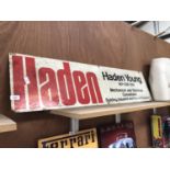 A LARGE ENAMEL 'HADEN YOUNG' SIGN