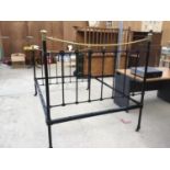 A WROUGHT IRON DOUBLE BED FRAME