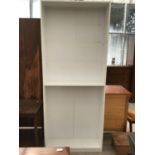 A MODERN WHITE BOOKCASE