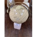 A GLOBE ON WOODEN BASE