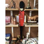 A TALL WOODEN MODEL OF A BEEFEATER