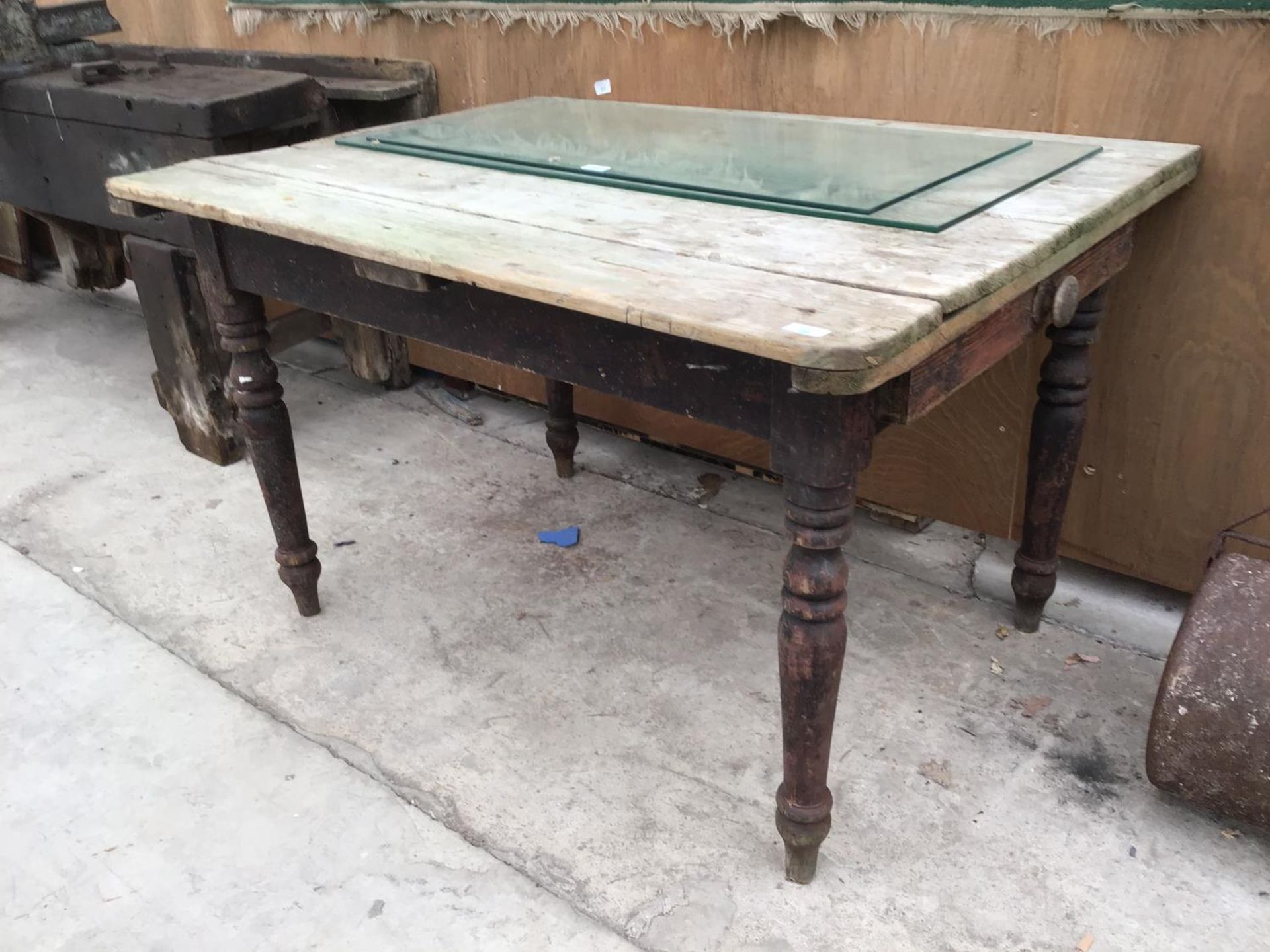 A VINTAGE PINE FARMHOUSE STYLE TABLE WITH DRAWER