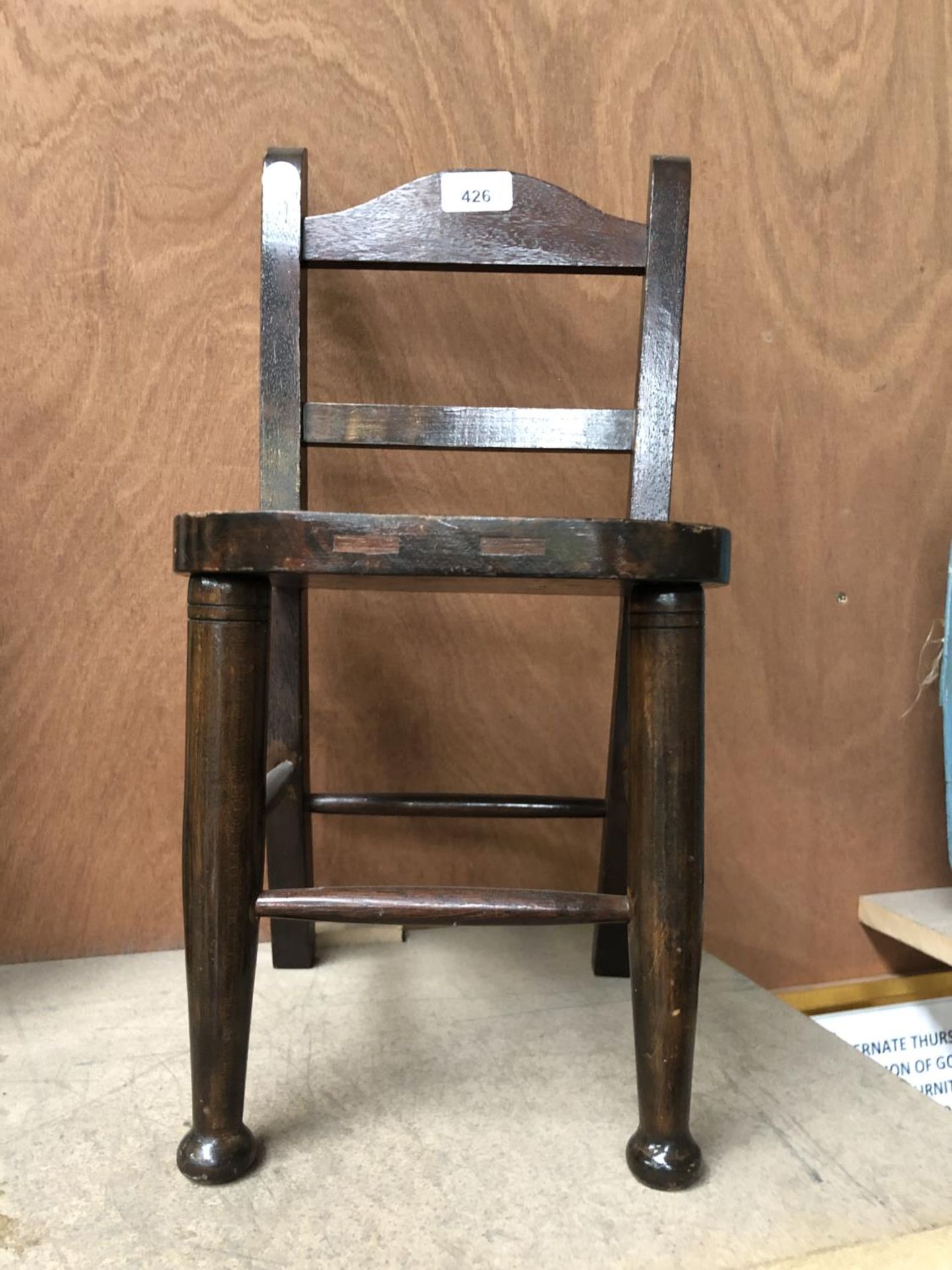 A VINTAGE STYLE WOODEN DOLLS CHAIR