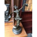 A BRONZE DANCING FIGURE ON A MARBLE BASE, SIGNED