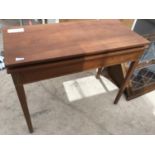 A MAHOGANY INLAID FOLD OVER TABLE