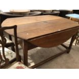 A CIRCULAR FRENCH OAK DROP LEAF DINING TABLE TOGETHER WITH MATCHING SEVEN DINING CHAIRS