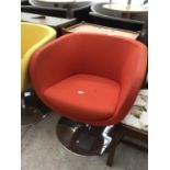 A RETRO RED FABRIC SWIVEL TUB CHAIR IN CIRCULAR CHROME SUPPORT