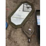 A CONCRETE FACE FOR A FOUNTAIN AND A BRASS FRAMED MIRROR
