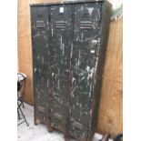 A VINTAGE THREE CUPBOARD METAL LOCKER UNIT